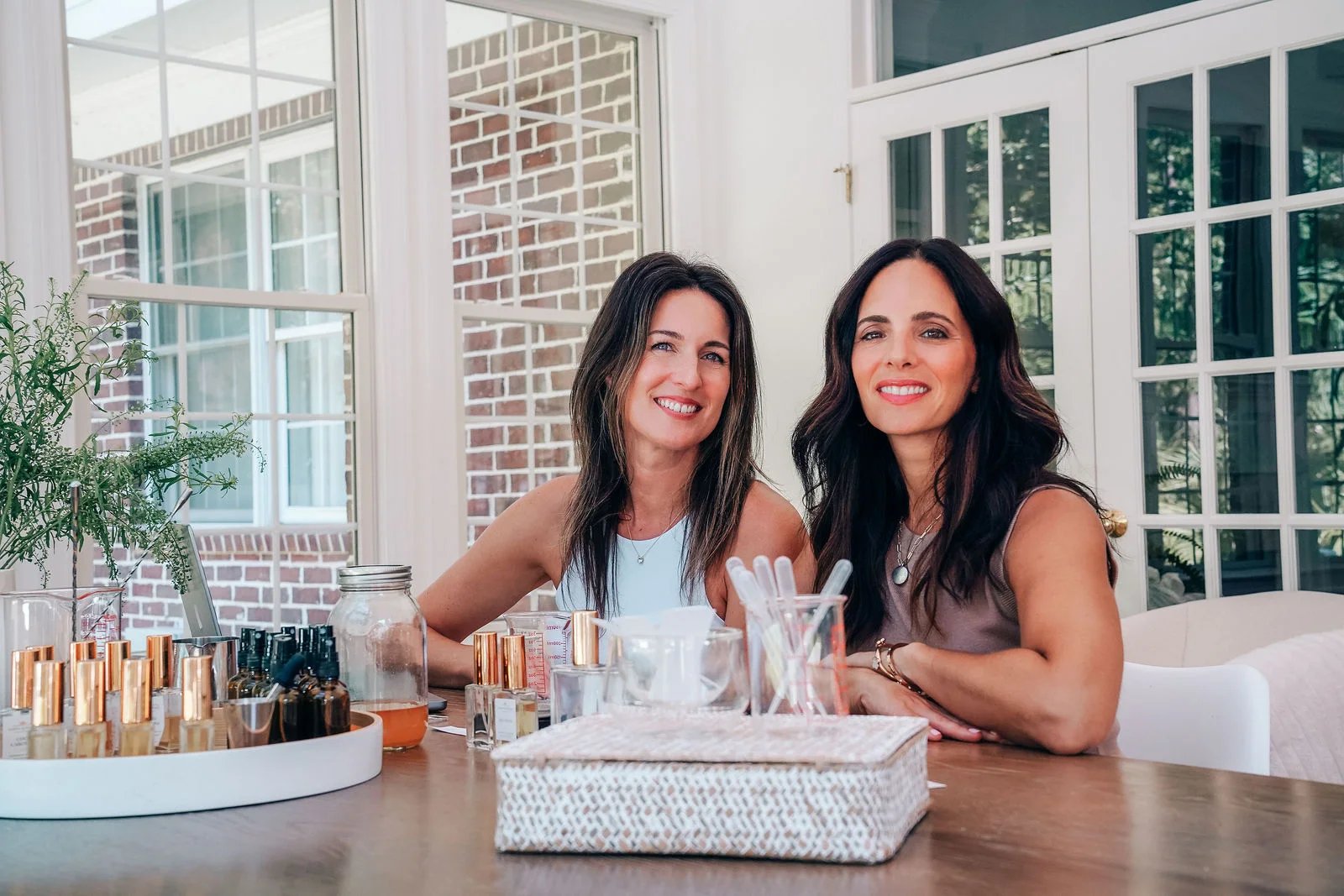 Lori and Holly at the table with the collection